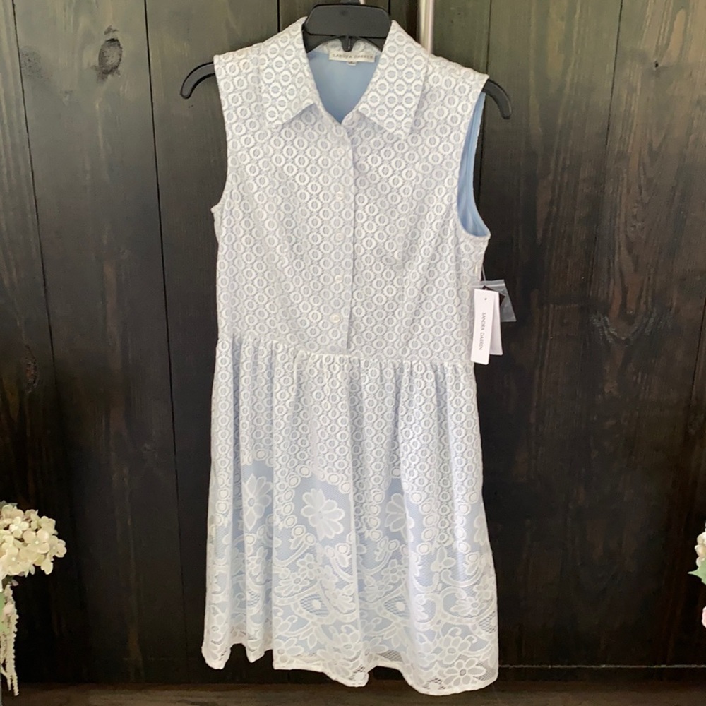 White and blue half button short sleeve dress.  Never been work.  New with tags.